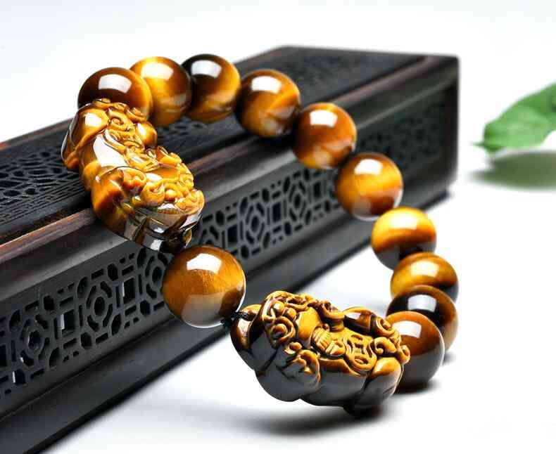 黄虎眼石是什么材质(黄虎眼石是什么材质吸铁石吸的到吗)